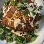 Delicious Whole Roasted Cauliflower With Pomegranate Tahini Sauce