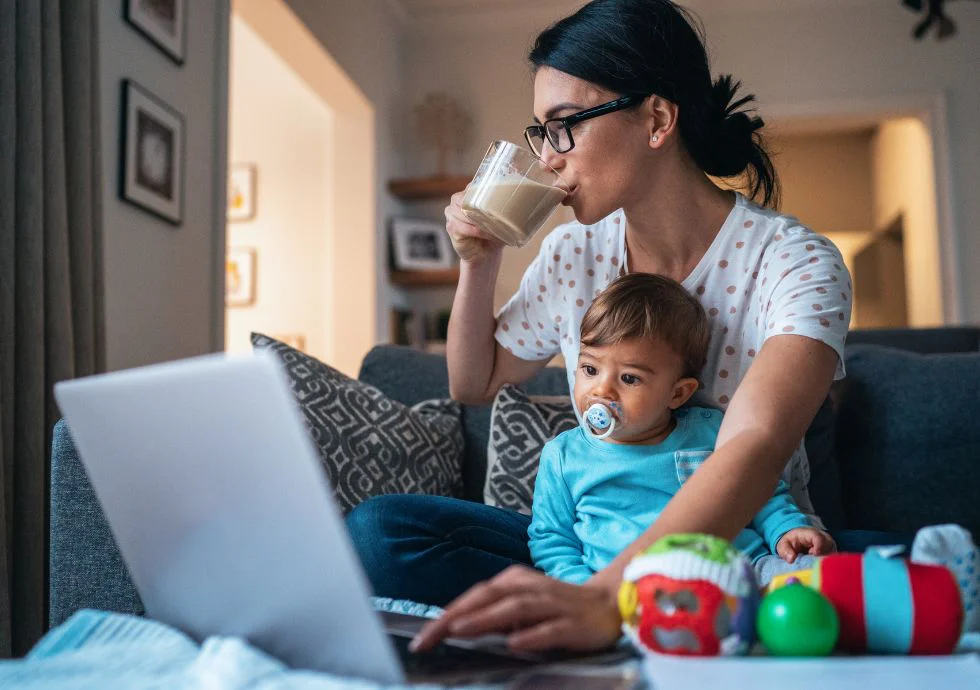 Mother working and drinking coffee