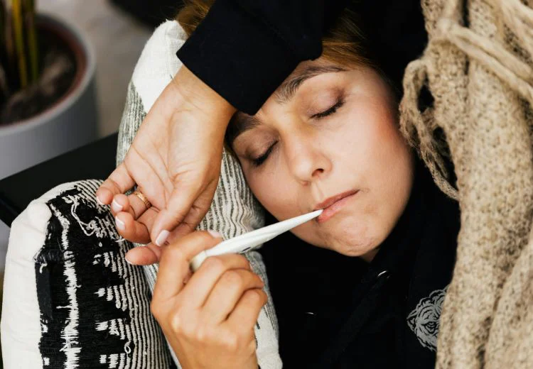 Woman taking her temperature during the super flu