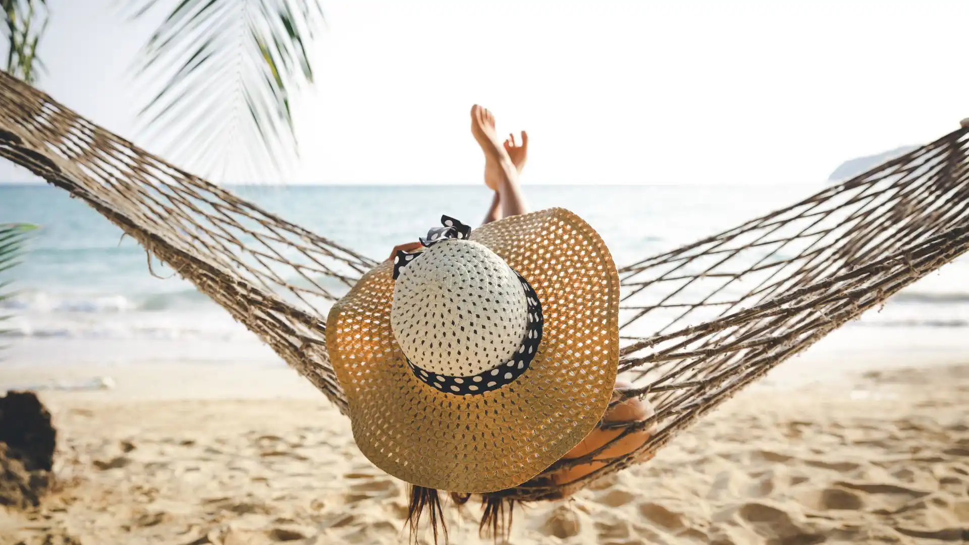 Deep sleep while traveling in a hammock on the beach